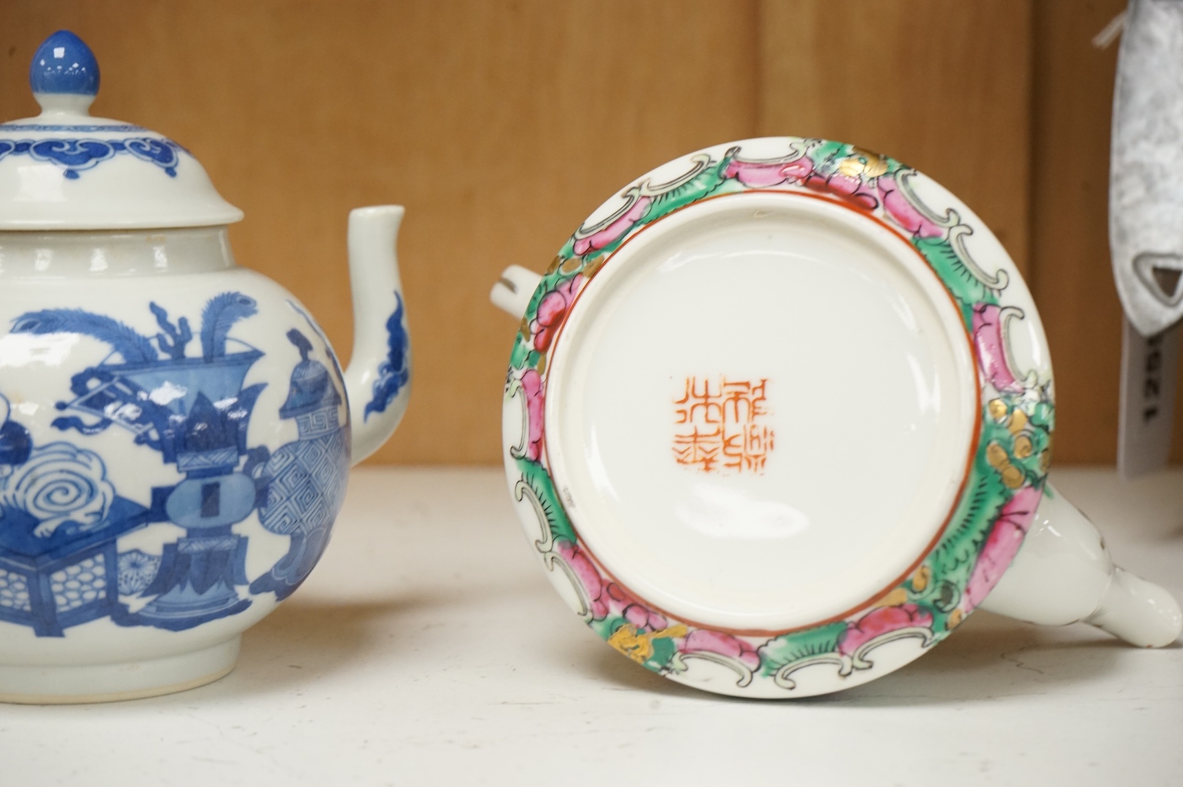 Two Chinese teapots comprising a blue and white and famille rose example, largest 16cm wide